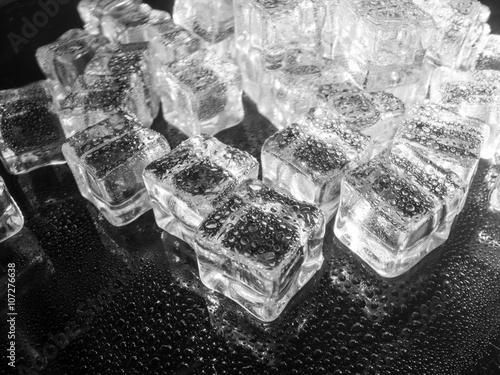 fake ice cubes sprayed with water black and white abstract concept