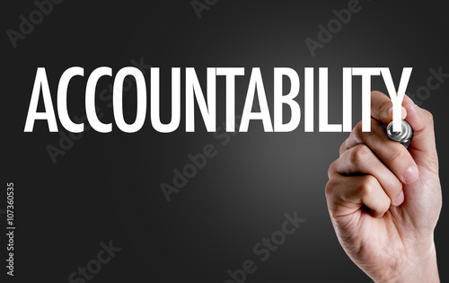 Hand writing the text: Accountability