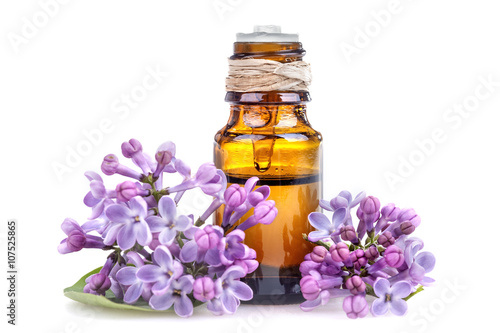 Essential oil made from lilac on a white background