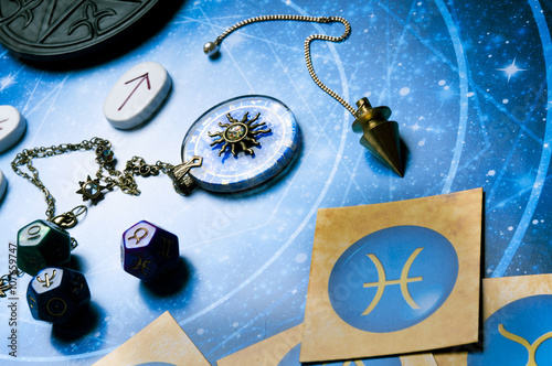 esoteric table with astrology and divination objects