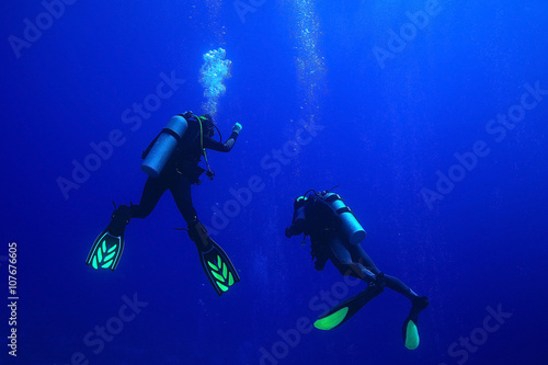 group of divers passing exams open water