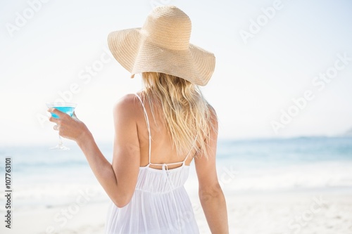 Blonde woman drinking cocktail