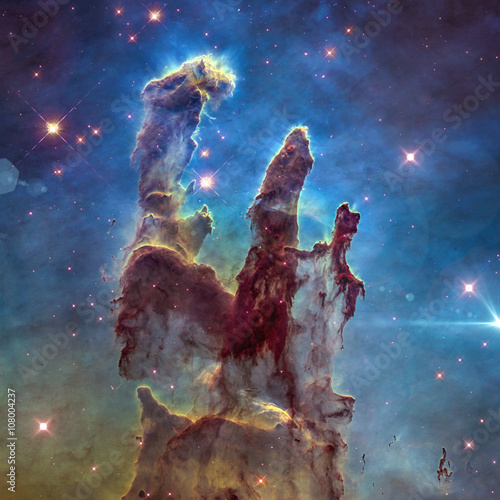 The Eagle Nebula's Pillars of Creation. Retouched image. Elements of this image furnished by NASA.