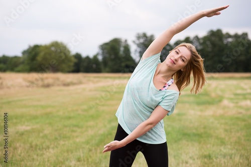 Doing side stretch outside