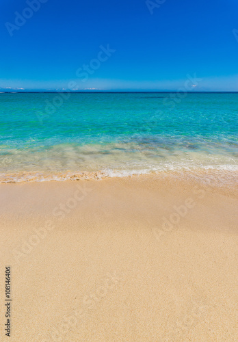 Beautiful ocean with turquoise clear water and sand beach