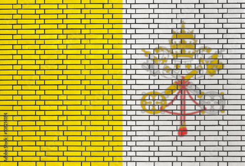 Vatican City flag painted on brick wall