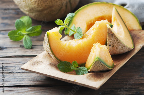 Fresh sweet orange melon and green mint