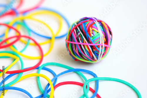 Colorful rubber band ball on white background