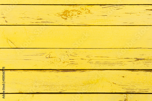 yellow wooden background made of old planks 