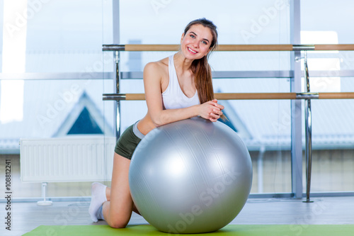 fitness, sport, training and people concept - woman with fitness ball