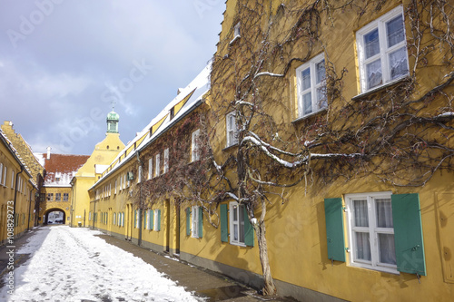 Small street in the Fuggerei district in Augsburg, Germany