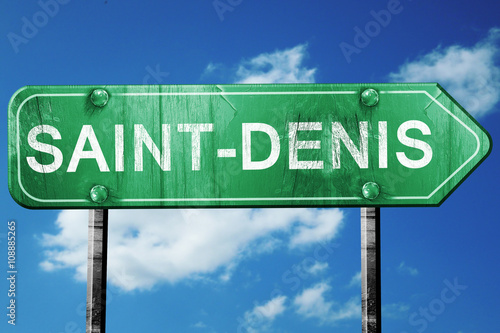 saint-denis road sign, vintage green with clouds background