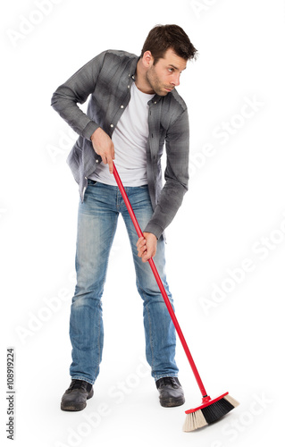 Young worker with a broom