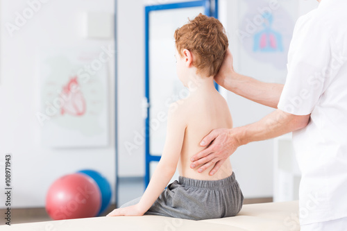 Boy with scoliosis during rehabilitation