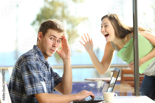 Man ignoring a stalker woman