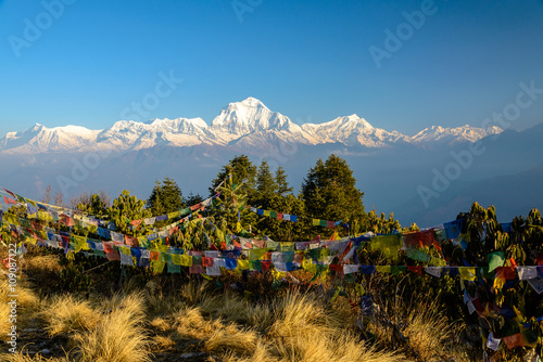 Annapurna summit with view from Poonhill, tibetan praying flags in the front, Nepal