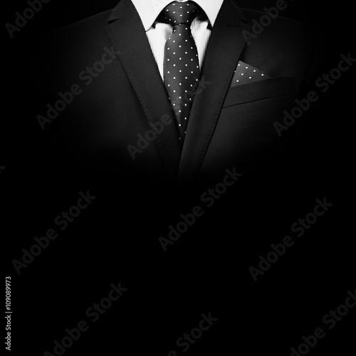 man in suit on a black background