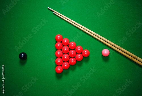 snooker balls set on a green table