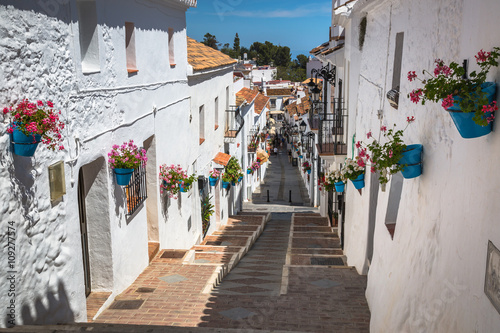 Street with flowers in the Mijas town, Spain