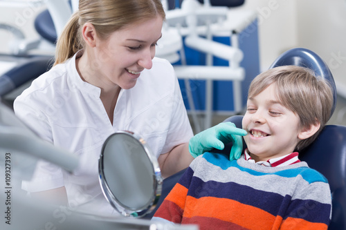 Having his monthly orthodontic checkup