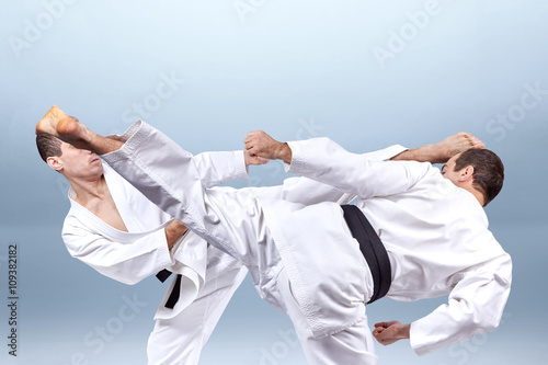 Two kick legs executes man in karategi
