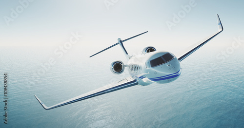 Picture of white luxury generic design private jet flying over the empty sea. Blue sky at background. Luxury travel concept. Horizontal . 3d rendering