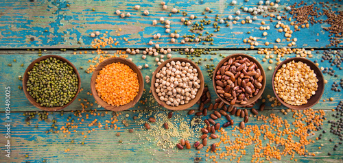 Raw legume on old rustic wooden table.