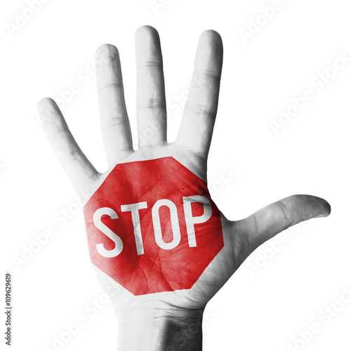 Hand raised gesture with stop sign painted, concept - isolated on white background