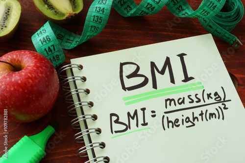 BMI body mass index (metric formula) written on a notepad sheet.