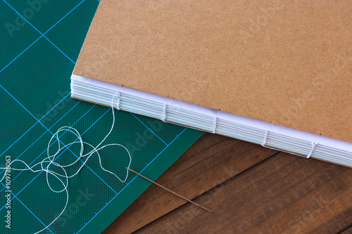 Handbound book with needle and thread