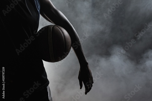 Closeup of a man holding a basketball
