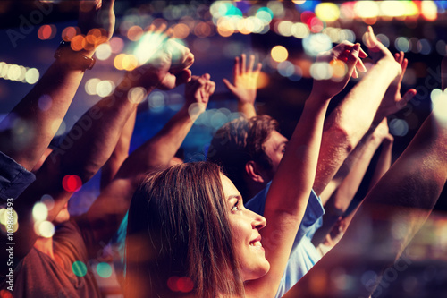 smiling friends at concert in club