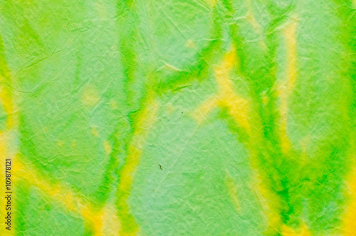 green and yellow painted crepe paper background