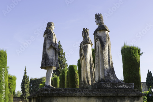 Statues of the Catholic Monarchs (Ferdinand and Isabella) and Christopher Columbus in the gardens of the Alcazar in Cordoba, Spain