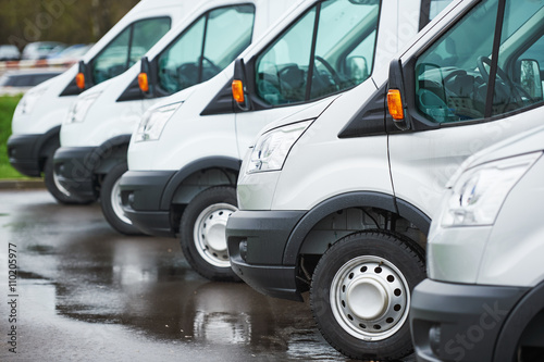 transporting service company. commercial delivery vans in row 