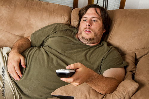 Fat lazy guy on the couch