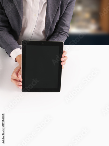 hands holding contemporary digital tablet