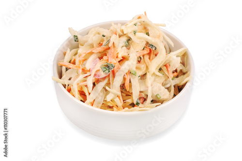 Side view of bowl filled with coleslaw isolated on white background.