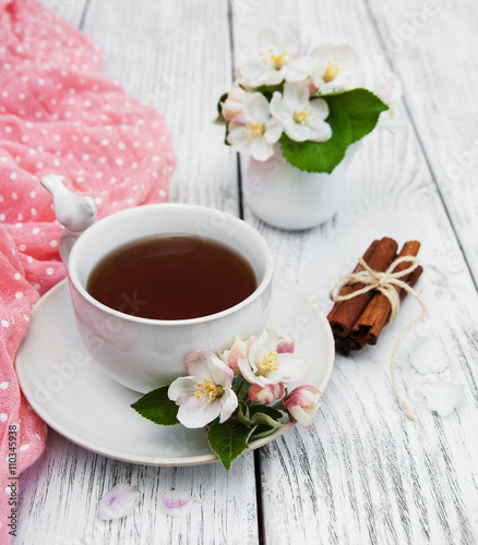 cup of tea with apple blossoms