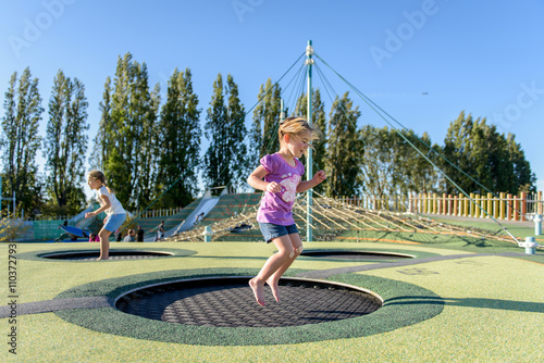 Girl jumping on a trampoline.