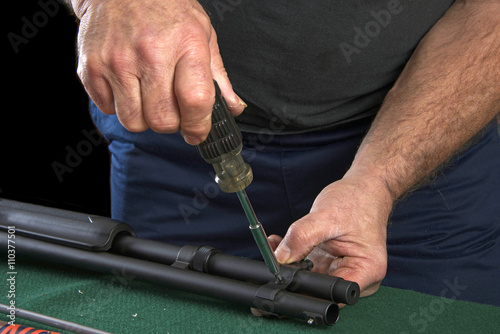 Gunsmith replacing clamp to barrel on 20 gauge pump action shotgun