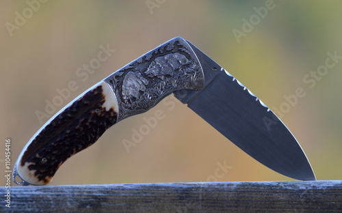 hunting pocket knife with wild boars engraving