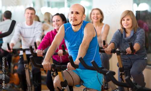 Man on fitness cycle training