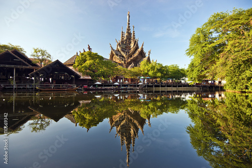 Sanctuary of truth and park in Pattaya reflecting in water