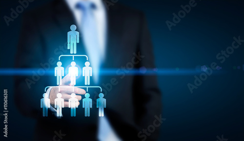 Businessman pointing at hierarchy