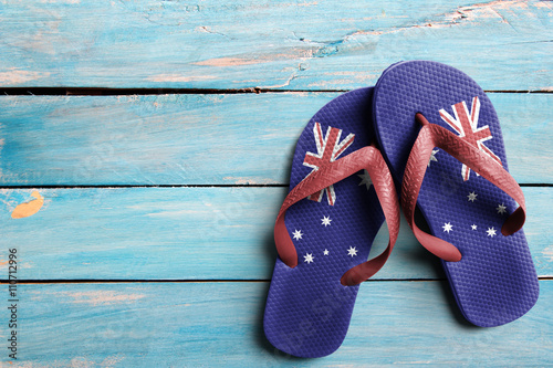 Thongs with flag of Australia, on blue wooden boards
