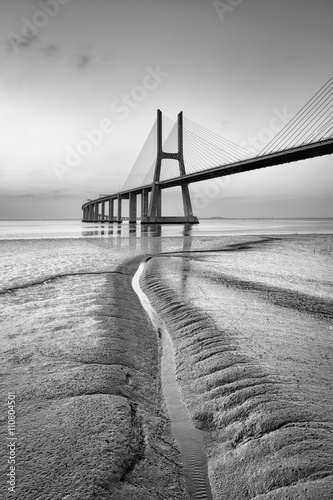 Vasco da Gama bridge at black and white, sunrise Lisbon