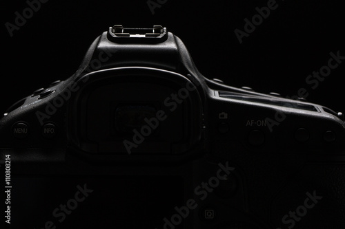 Professional modern DSLR camera low key stock photo/image 