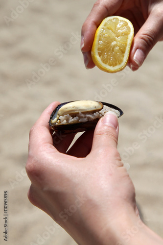 stuffed mussels and lemon (Its name is midye dolma in Turkish)