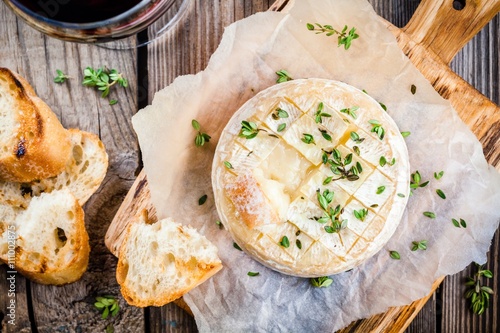 Baked camembert with toasts and thyme